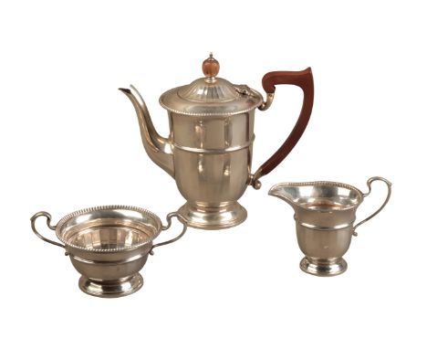 A GEORGE V SILVER THREE PIECE COFFEE SERVICEby Fenton Russell & Co, Birmingham 1932, with gadrooned rims and girdled bodies, 