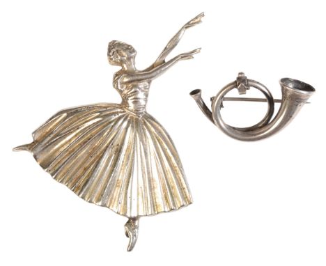 A BALLERINA BROOCHin sterling silver, full British hallmarks, secured with a pin clasp, c.7.1cm; together with a horn brooch 