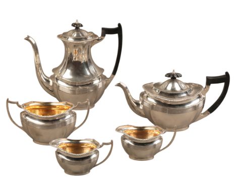 A GEORGE V SILVER FIVE PIECE TEA SERVICEby the Barker Bros, Chester 1916 (milk jug 1917) consisting of coffee pot, sucriere a