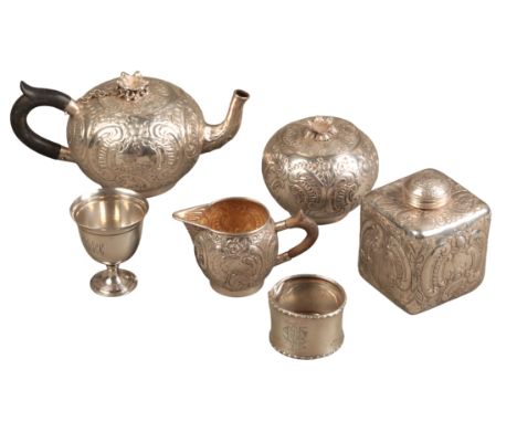 A MIDDLE EASTERN WHITE METAL TEA SETwith leaf embossed and engraved bodies, comprising spherical teapot with chained lid, sph