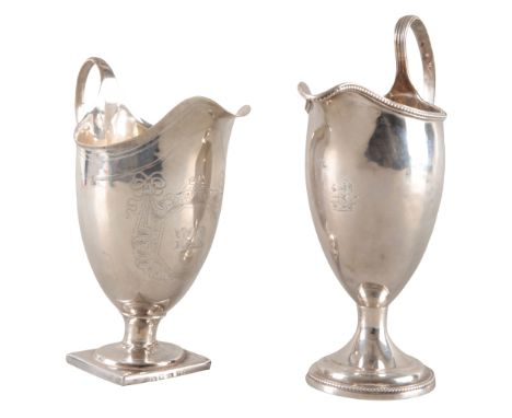 A GEORGE III SILVER HELMET SHAPE CREAM JUGLondon 1792, maker's mark rubbed, with finely engraved armorial, on square foot, 14