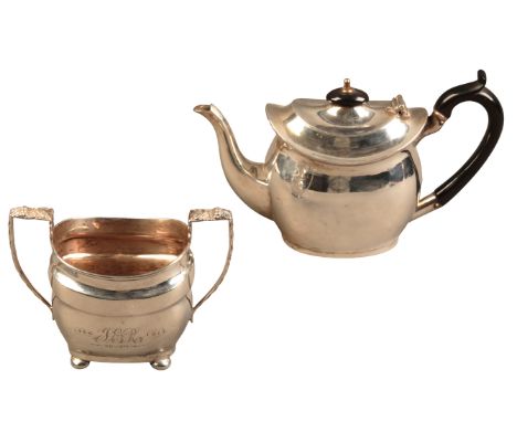 AN EDWARD VII SILVER TEAPOT AND SUCRIEREby George Nash & Ridley Hayes, Chester 1908, of Georgian style, the teapot with ebony