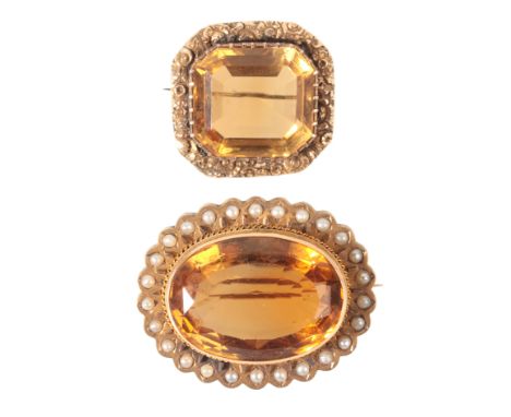 TWO ANTIQUE CITRINE BROOCHESin yellow gold, set with an oval cut citrine of c.128.3 carats, held in a bezel setting, surround