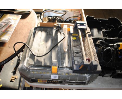 A Titan TTB336TCB electric tile cutter and a manual tile cutter