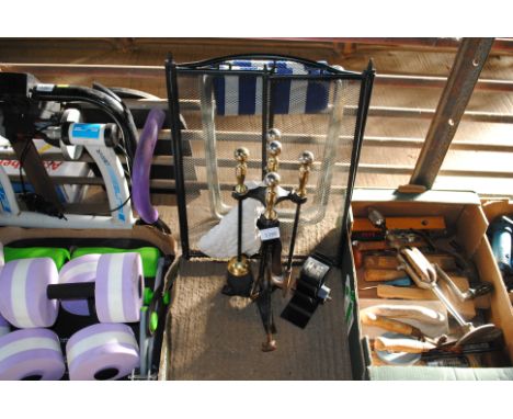 A fire companion stand and contents of tools, a heat powered stove fan AF, a spark guard and two folding stands