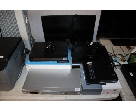 A Panasonic DVD/CD player; a Polaroid flat screen television and remote control; Humax Freeview box and two DVD players 