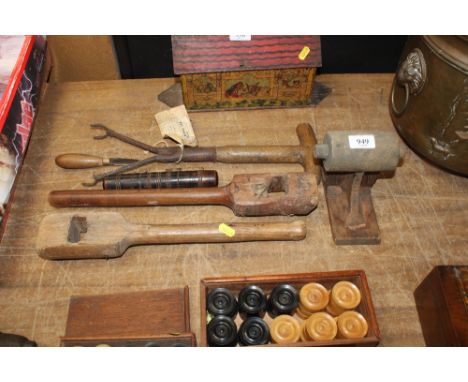 A collection of vintage tools including needle cases 