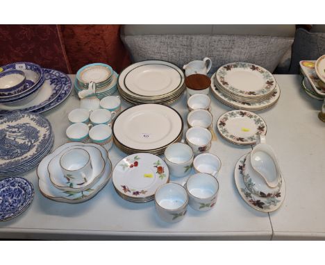 A quantity of Royal Worcester "Evesham" tea ware and a quantity of Royal Doulton tea and dinnerware 