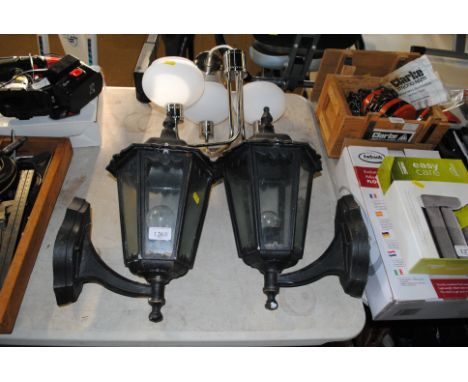 Two outdoor wall mounting lanterns and a modern chrome three branch ceiling light fitting