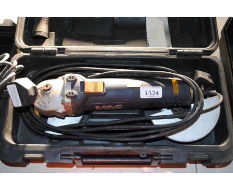 A MacAllister MAG600-115 angle grinder in fitted plastic case with attachments and instruction guide