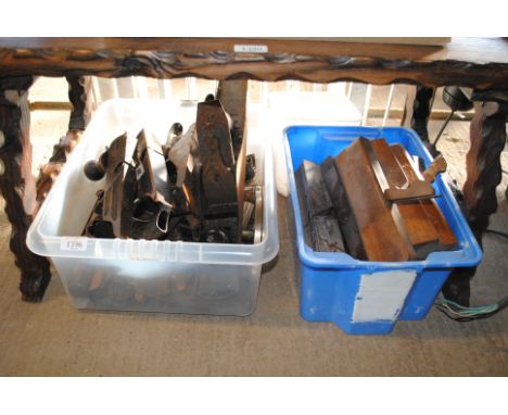 A box containing various tools to include a large smoothing plane, sharpening stone, a Stanley No.192 smoothing plane, a quan