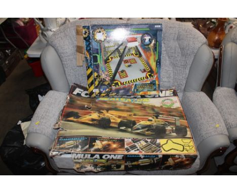 A Scalextric set and a Robot Wars Battle Arena sold a seen