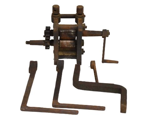 Bench-top sheet metal roller press, with crank handles.