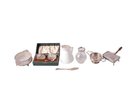 A silver sugar box, Wilson &amp; Gill, London 1959, shell thumbpiece, on four raised hoof feet, wooden handle; frosted glass 