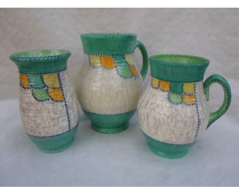 Three 1930s Crown Ducal vases, designed by Charlotte Rhead in the 4015 Patch pattern, each having a tube-lined decoration in 