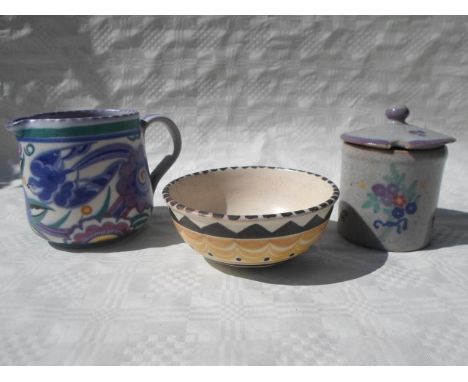 Three pieces of early 20th century Carter, Stabler & Adams Poole Pottery, to include a Bluebird pattern jug (9.5cm tall), a s
