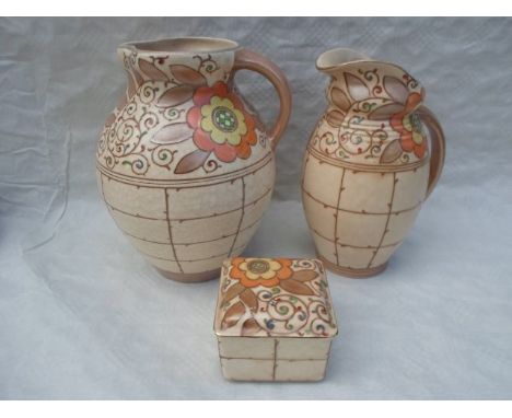 Two 1940s HJ Wood Bursleyware jugs and a trinket box, each in the TL3 Trellis pattern designed by Charlotte Rhead, featuring 