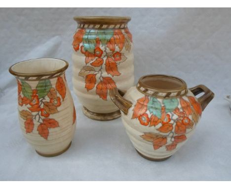 Three 1930s Crown Ducal vases, designed by Charlotte Rhead, each in the 4921 Golden Leaves pattern, having a tube-lined decor
