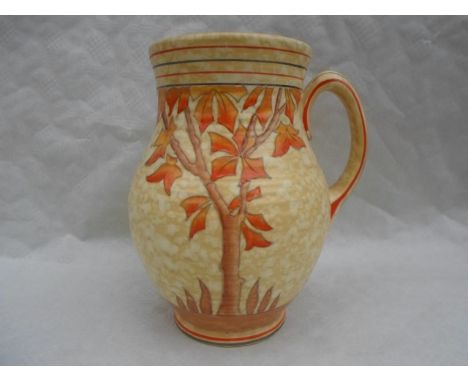 A 1930s Crown Ducal single-handled vase, designed by Charlotte Rhead in the 4795 Spanish Tree pattern, having a tube-lined de