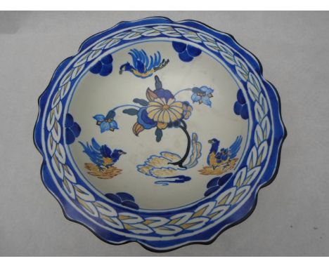 An early 20th century Wardle shallow bowl, designed by Frederick A Rhead, having a design of birds and stylized flowers withi