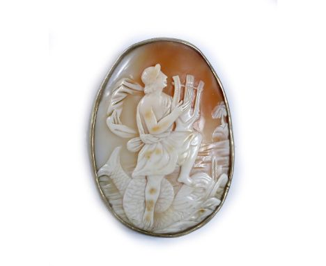 A Victorian carved cameo of oval form showing Pan playing his pipes