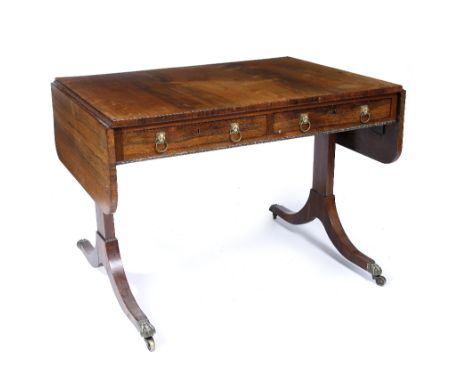 A Regency rosewood sofa table with gilt lion ring handles, 160cm across x 72.5cm