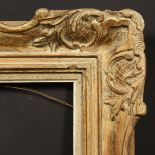 A 20th Century carved frame, rebate size - 14.5" x 9.5" (37 x 24cm).