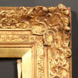 A 20th Century frame with centres and corners, rebate size - 30.5" x 33.5" (77.5 x 85cm).
