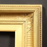 A 19th Century gilt composition frame, rebate size - 12" x 18" (30.5 x 46cm).