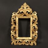 An Early 19th Century carved Florentine frame, rebate size - 7.5" x 5" (19 x 13cm).