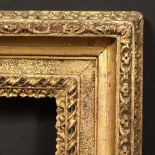 An 18th/19th Century carved frame with sand channel, rebate size - 12.25" x 9.75" (31 x 24.5cm).