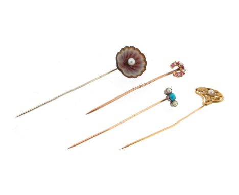 An Art nouveau gold stick pin, of foliate design and set with a pearl. A ruby and diamond horseshoe brooch. An agate stickpin