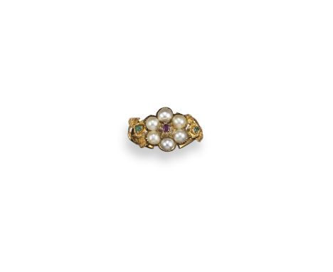 An early 19th century foliate ring, the flowerhead set with pearls and a ruby to the centre, with textured gold emerald-set f