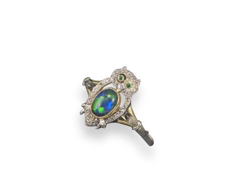 An unusual owl ring, set with an oval-shaped opal, small diamonds and emerald eyes, in silver and gold. Size R. Case.