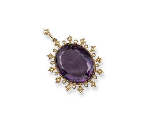 A 19th century amethyst and seed pearl mounted gold pendant, the large oval-shaped amethyst is set within a border of seed pe