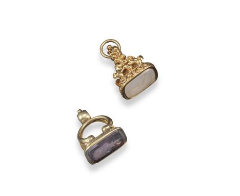 A gold early 19th-century stirrup-form fob seal, mounted with an amethyst matrix engraved with arms and ducal crest. The matr