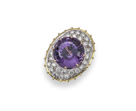 An amethyst and diamond-set cluster ring, the circular cut amethyst is pavé-set within a surround of round brilliant-cut diam