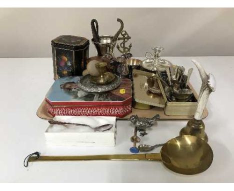 A tray of commemorative tins, cutlery, plated ware, brass ladle etc 