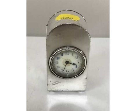 A small silver dome top desk clock with French movement