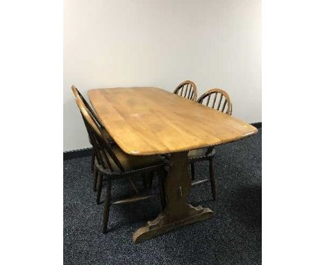 An Ercol refectory table and four chairs 
