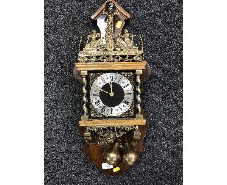 A reproduction weight driven striking wall clock