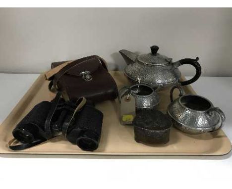 A tray of three piece Craftsman pewter tea service, oriental style trinket box and a pair of Jenoptem binoculars in case 