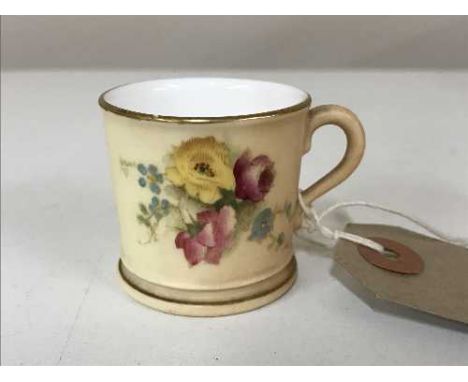 A miniature Royal Worcester hand painted blush ivory mug