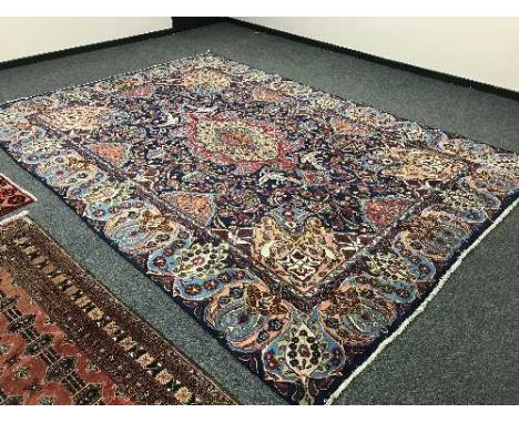 A large Persian carpet on blue ground, 413 cm x 288 cm