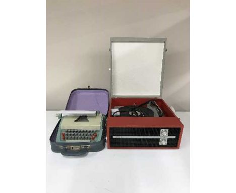 A mid 20th century table top Fidelity record player and a cased typewriter 