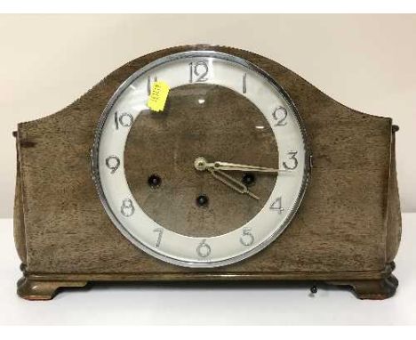 A walnut cased mantel clock 
