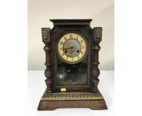 A late 19th century American pine cased mantle clock 