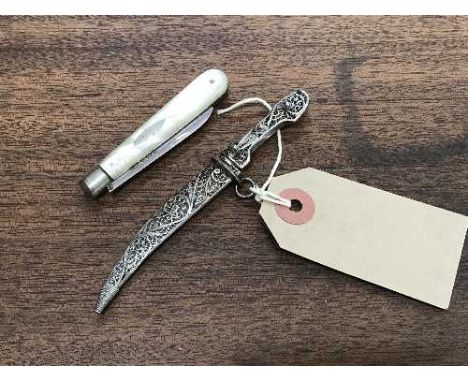 A Russian silver filigree miniature dagger in sheath, together with a silver and mother of pearl folding fruit knife, Sheffie