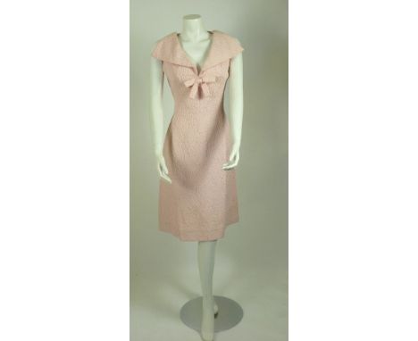 A Christian Dior London Modele Original pink shift dress, 
c1960, in a textured pink leaf woven design with a large collar an