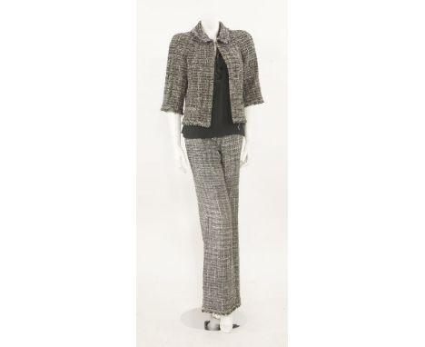 A Chanel grey wool tweed trouser suit,the jacket with button detail at neckline with pockets to the front, metallic thread zi